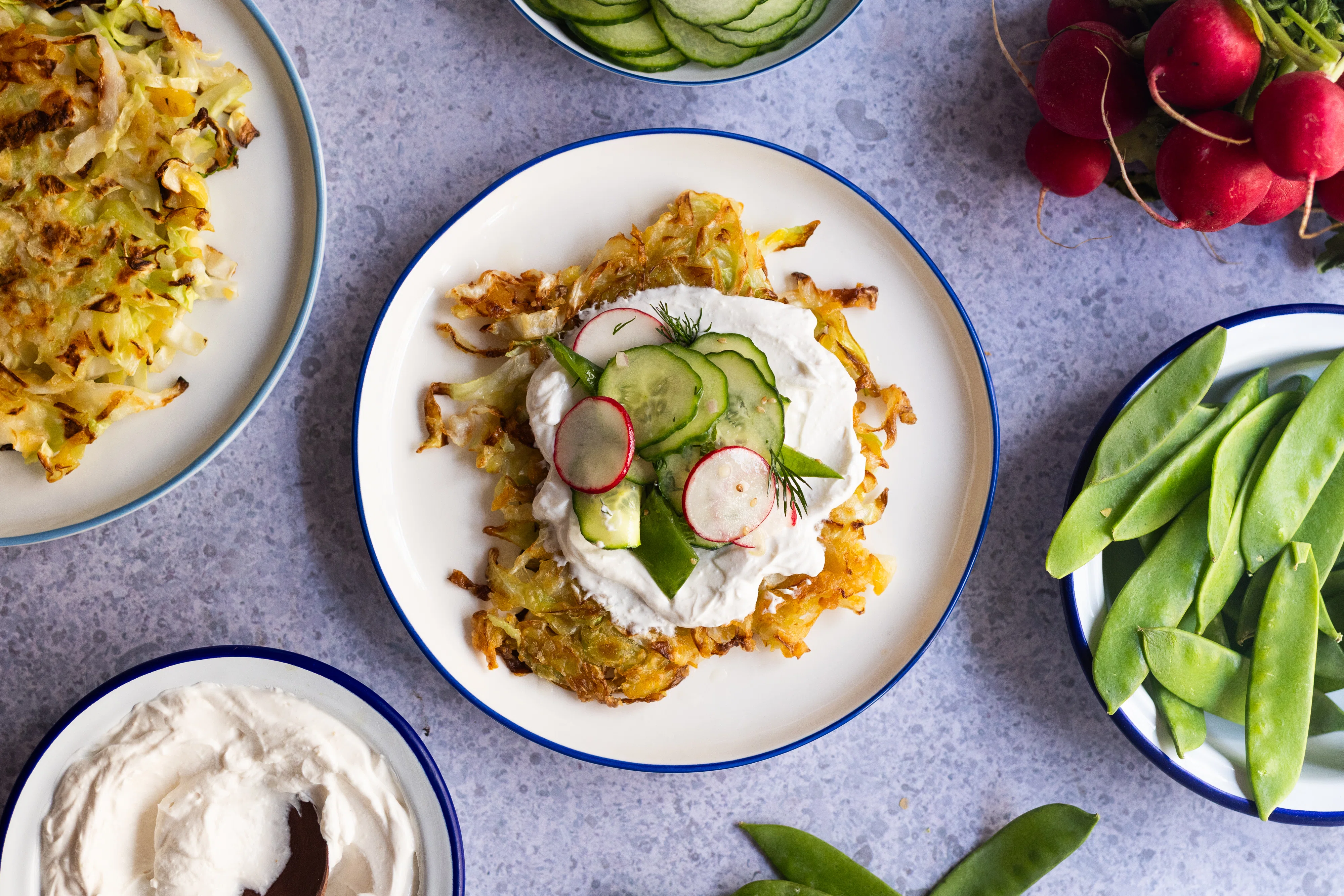 Pointed Cabbage Rösti with Sour Cream and Radish-Cucumber-Sugar Snap Pea Salad