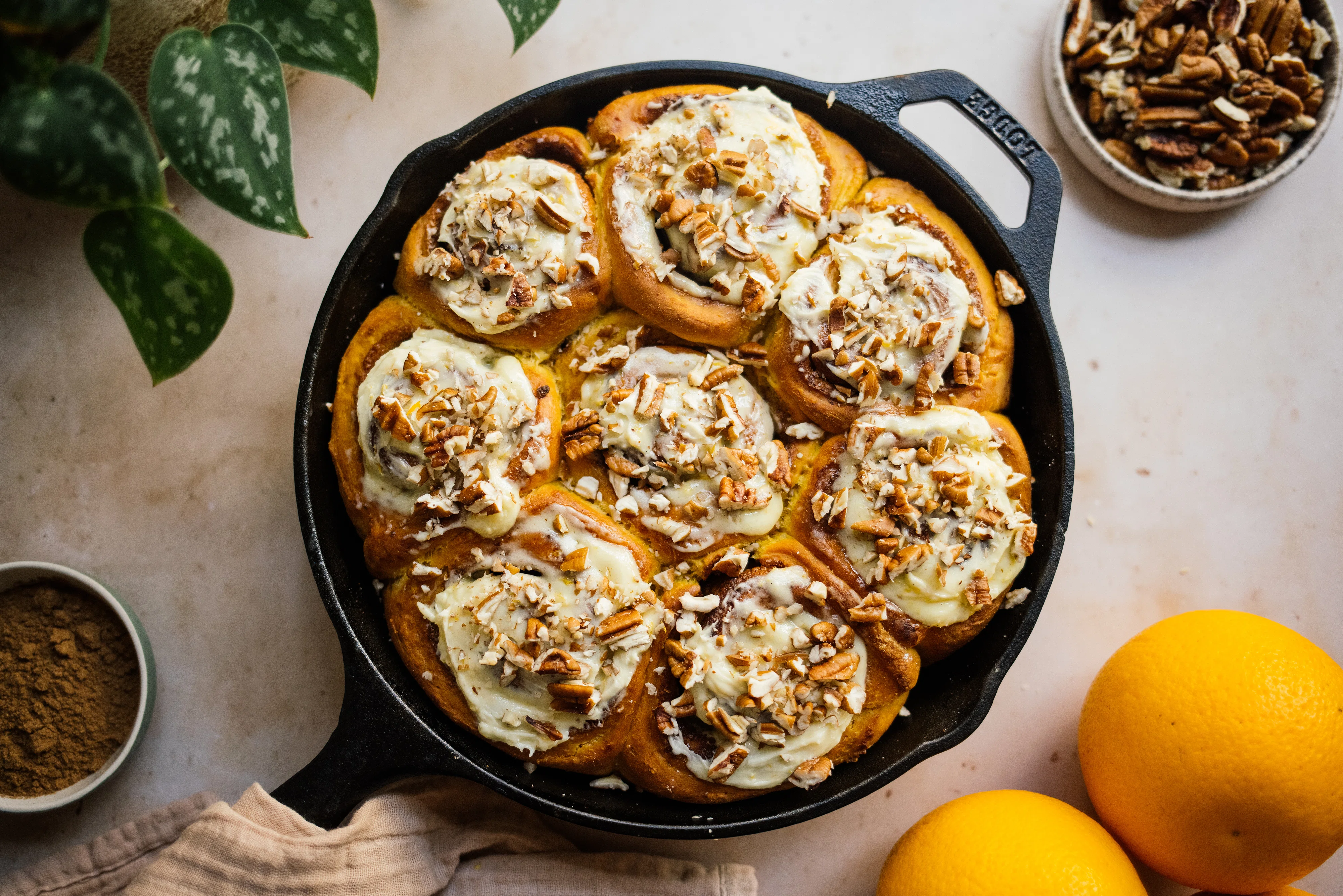 Vegan Pumpkin Spice Buns with Orange Buttercream and Pecans